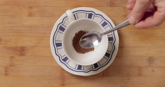 Making morning coffee, measuring portion, instant product