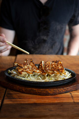 Dim Sum Fried Dumplings At Restaurant With Chopsticks Steaming Hot Food