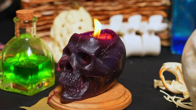 Witchcraft composition selective focus with candles lights, magic items tools and symbols.  Occult and esoteric concept. Mystic Halloween. Magic chemistry and witch craft.