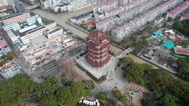 Aerial drone view of ancient Heming tower in Chuansha town, Shanghai, China. It is a building nearly the same as Yellow Crane tower in Wuhan. 4k real time footage high angle view.
