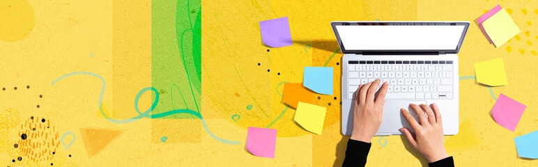 Laptop computer with many sticky notes - Flat lay