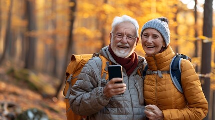 Senior couple using a smartphone to capture travel memories Stock Photo with copy space