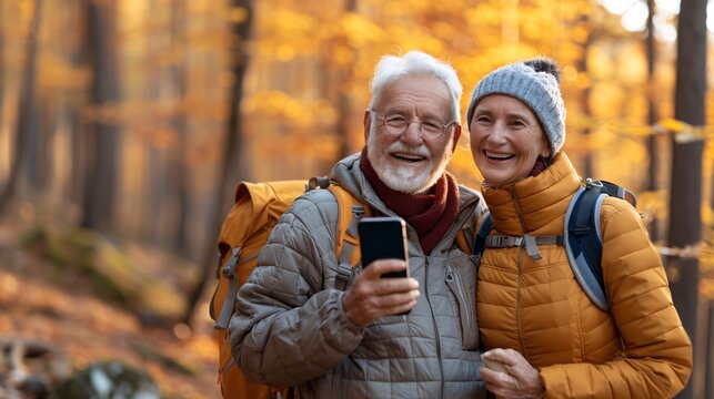 Senior couple using a smartphone to capture travel memories Stock Photo with copy space