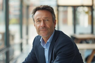 Fototapeta premium Portrait of a confident mature businessman working in a modern office