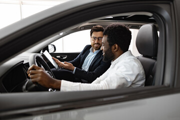 Vehicle purchase, customer service, friendly interaction inside car dealership environment....