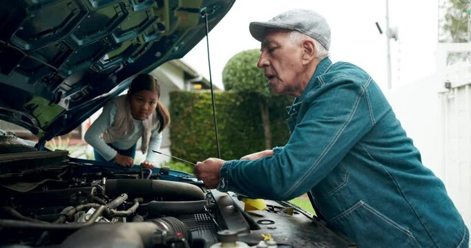 Senior man, teaching and child with car maintenance for checking oil, service or engine at home. Mature male person with dip stick for vehicle safety, repair or inspection by little kid outside house