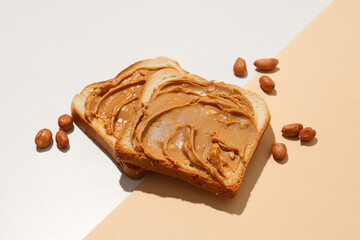 Sandwiches with peanut paste, on a light background.