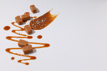 Cubes of salted caramel on a white background