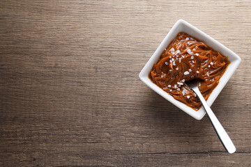 Delicious salted caramel in a white bowl