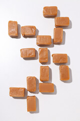 Cubes of salted caramel on a white background