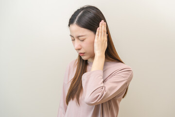 Tinnitus concept, sick asian young woman, girl have ear pain or earache, hand touch plug ear, suffering painful otitis from loud of noisy sound, inflammation. Health care nerve deaf eardrum disease.