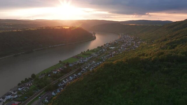 Flying over the hills of Braubach, Germany with the sunsetting over the Rhine river.