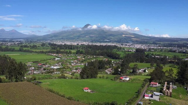 Aerial drone shot of guitig neighborhood of canton mejia in the province of Pichincha, Ecuador with view on El coraz&oacute;n volcano, copy space, pedestal shot