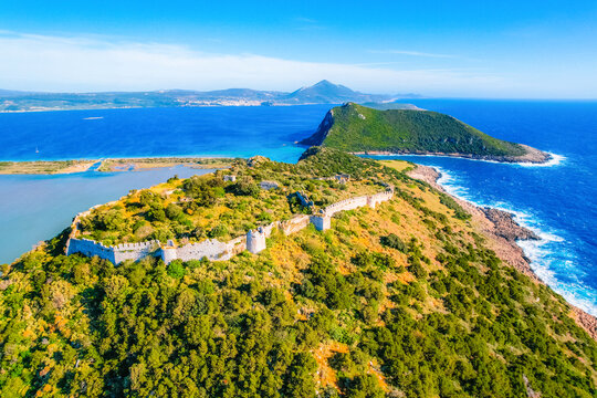 Aerial view of voidokilia beach, lagoon with beaches in mediterranean, Ionian Sea, Pylos town , Greece. Navarino Castle on hill.