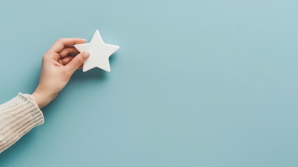 Blue background, woman's hand holding a star, customer service rating, experience concept, client satisfaction