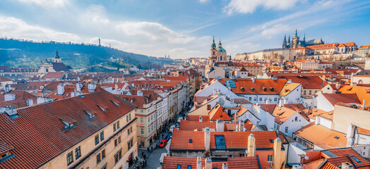 Obraz premium View of the city of Prague and the Vltava river with Charles bridge from Malostranske bridge towers in Prague, Czech Republic.