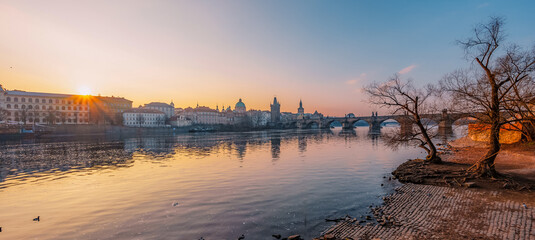 Obraz premium View of the city of Prague. Vltava river with Old Town Bridge Tower on Charles bridge in Prague, Czech Republic.