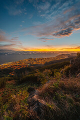 beautiful sunset over the city of Funchal on Madeira from the location Miradouro do Pico Alto. Mountains landscape