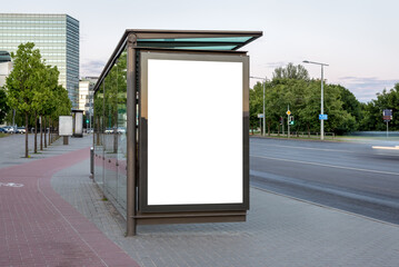 Mockup Of Bus Stop Vertical Billboard In Front Of Empty City Background.  Poster Stand On The Sidewalk