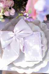 Vibrant florals and colorful menu on wedding table