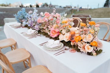 Wedding table with vibrant floral arrangements