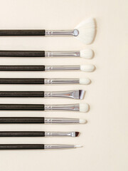 makeup brushes on a colored background.