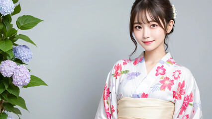 あじさいと浴衣の若い女性