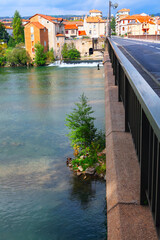 Pont Lerouge over river Tarn in Millau France. Picturesque bridge in Millau town, walk along the...