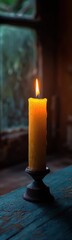 Candle that is lit on a table, Vertical background