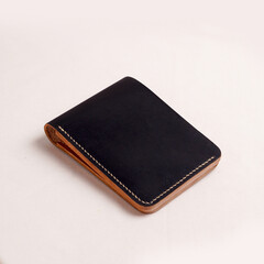 various leather wallets in various colors and cartoon cases with plain white backgrounds