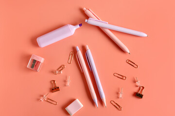 Naklejka premium Different school stationery on coral background