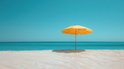 Yellow umbrella on the beach near the ocean, Travel concept