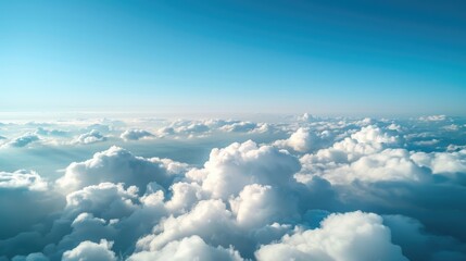 Aerial view of fluffy clouds and clear sky