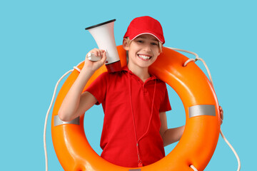 Little boy lifeguard with ring buoy and megaphone on blue background