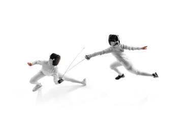 Female fencers practicing during duel, each aiming to improve their timing and accuracy against white studio background. Aerial view. Concept of professional sport, competition, strength and power. Ad