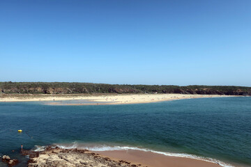 Vila Nova de Milfontes, Portugal. Praia do Farol is located at the mouth of the Mira River on the northern bank. 