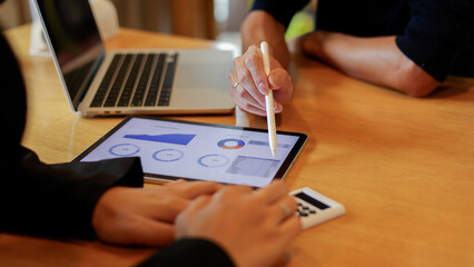 close up ceo or exceutive man hand point on dashboard screen tablet device for check and share planning or consulting with businesswoman partner for business team and work from home concept