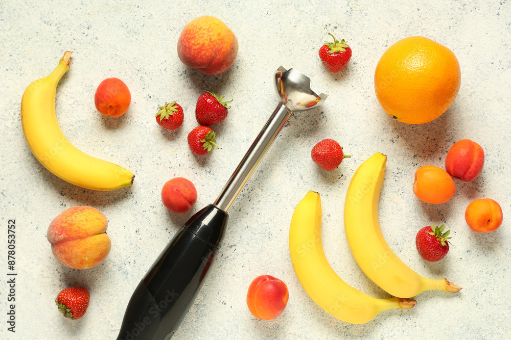 Wall mural hand blender and different fruits for preparing fresh smoothie on white background