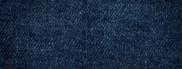 Naklejka premium Texture navy blue background from knitted jeans textile with wicker pattern. Vintage denim fabric
