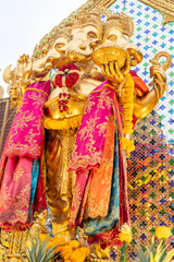 The statue of Lord Ganesha is enshrined in a shrine where many people come to worship in Bang Yai, Nonthaburi, Thailand.
