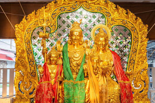 The bronze statues of Lord Shiva, Uma Devi and Ganesha are highly revered by many Buddhists. They often come to pay their respects here at Bang Yai Temple, Nonthaburi, Thailand.