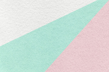 Fototapeta premium Texture of old craft white, green and pink paper background, macro. Vintage abstract cardboard