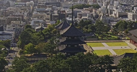 Nara Japan Aerial v4 zoomed flyover and around Noboriojicho capturing the five storied pagoda and Central golden hall in the Kofuku-ji Buddhist temples site - Shot with Mavic 3 Pro Cine - October