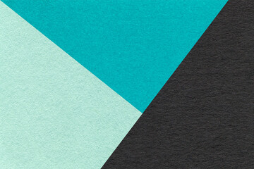 Fototapeta premium Texture of craft green, turquoise and black shade color paper background, macro. Vintage abstract blue cardboard