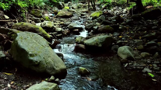 rone shot Clear river water flow, Dolo waterfall area river, Kediri, Indonesia