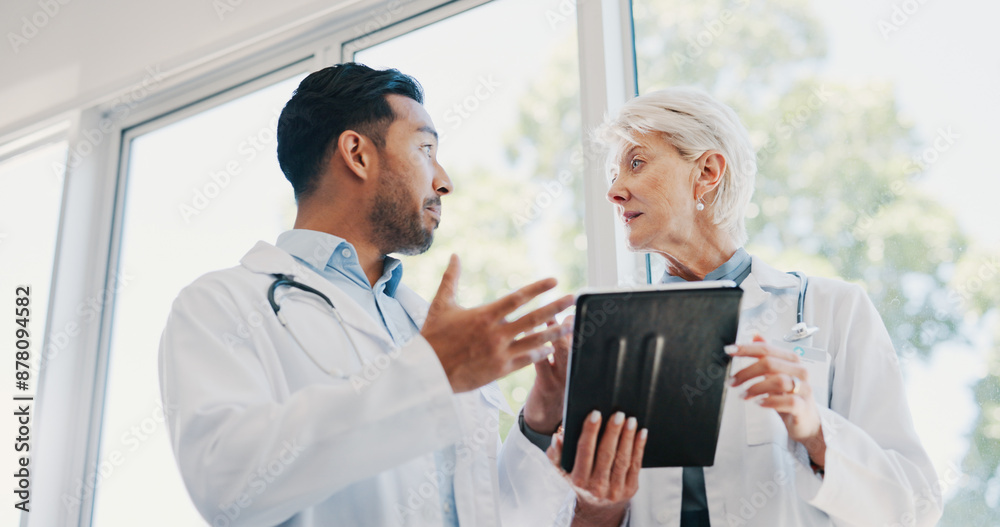 Canvas Prints Hospital, meeting and doctors with tablet in discussion for healthcare research, planning and help. Man, woman and low angle with tech at clinic for diagnosis, solution and review of patient records