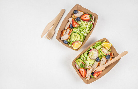 Healthy food in disposable eco friendly food packaging. Street food festival, catering service