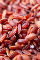 Uncooked, red rice. Food background texture. Close-up