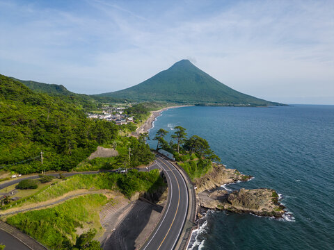 Kagoshima, Japan: Aerial drone view of the stunning coastal road of Kyushu with the Kaimon volcano by the sea in Japan.