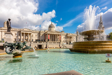 Fountain on Trafalgar square and National Gallery, London, UK